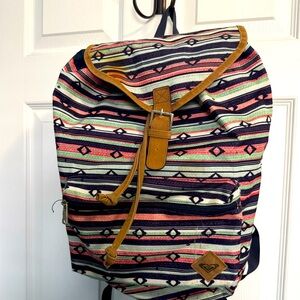 Multicolored fabric drawstring backpack.